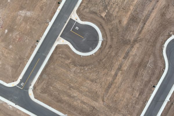 Professional climbing a career ladder, representing success achieved through enhanced emotional intelligence.